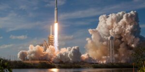 gray spacecraft taking off during daytime